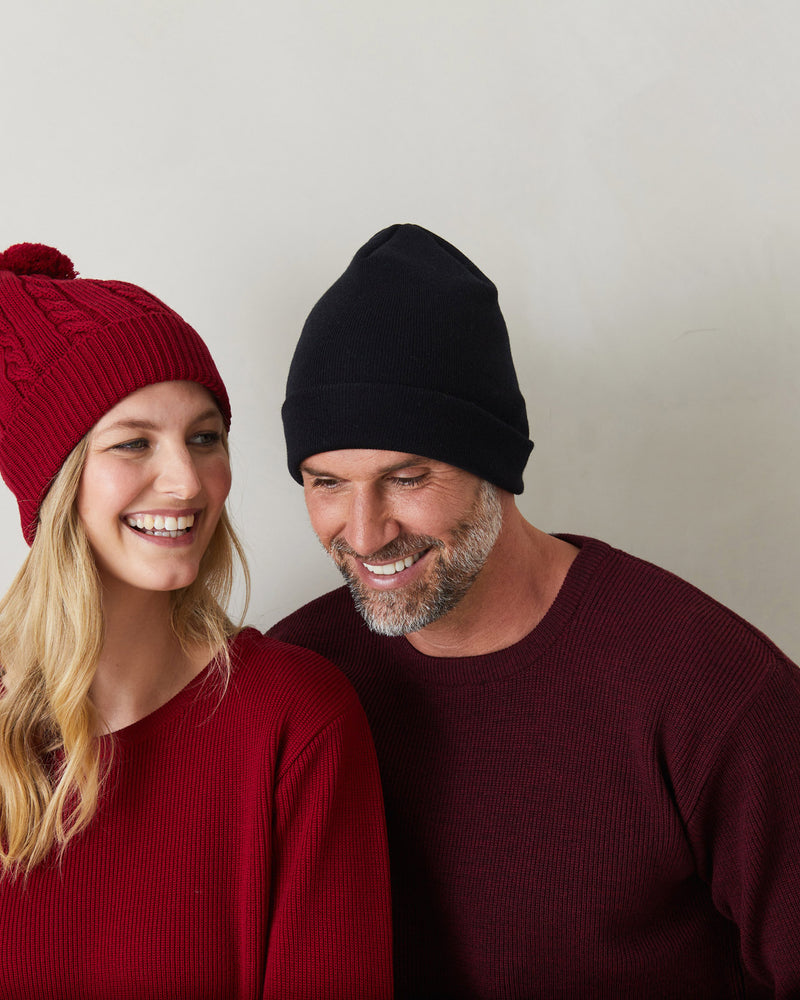 man and lady wearing red and blue wool scarf