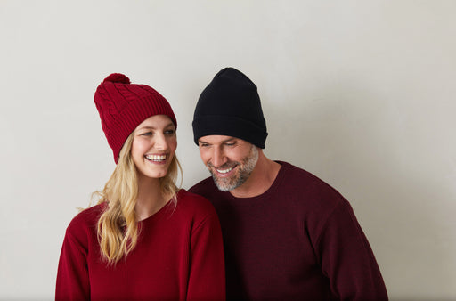 man and lady wearing red and blue wool scarf
