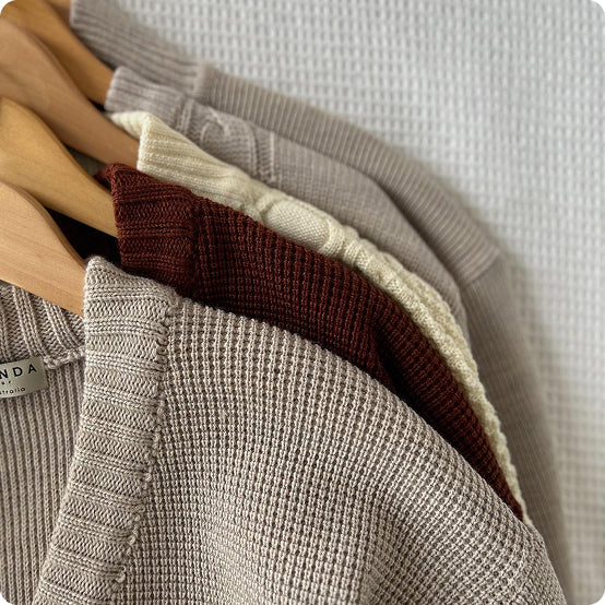 Aklanda merino knitwear on hangers